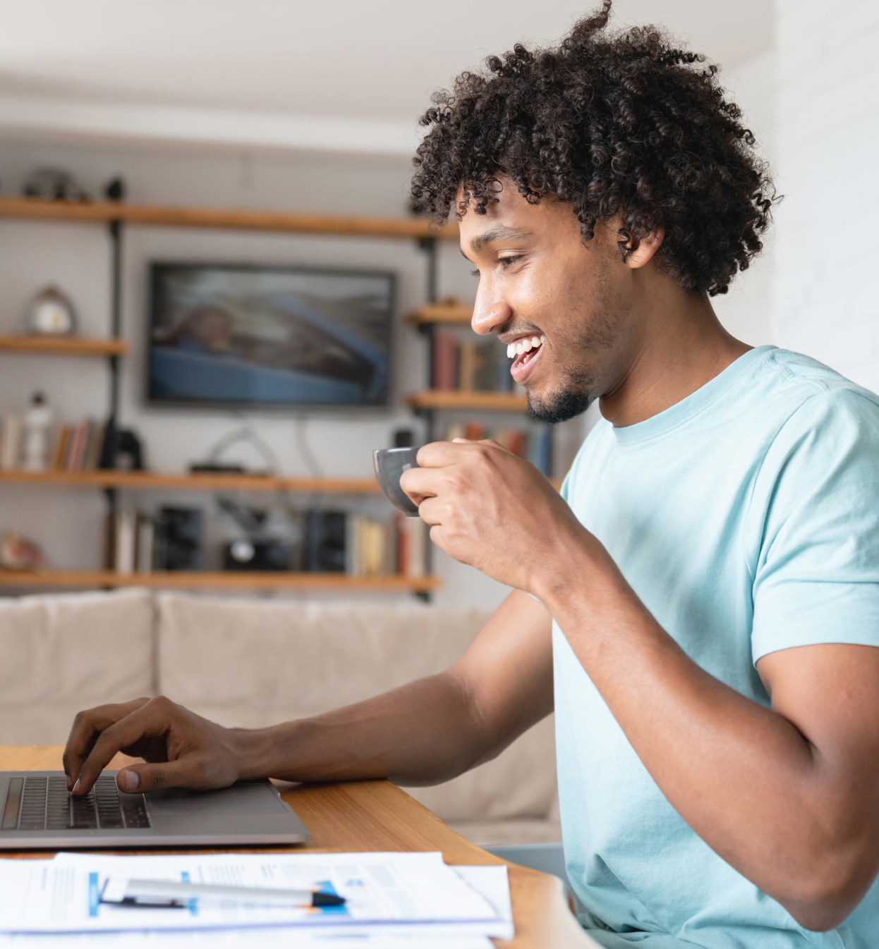 Man drinking coffee and researching vehicle warranty